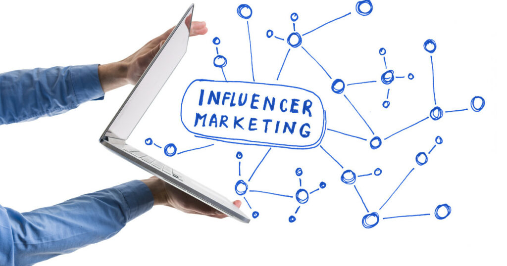 influencer marketing image depicting interconnected dots emerging from a laptop